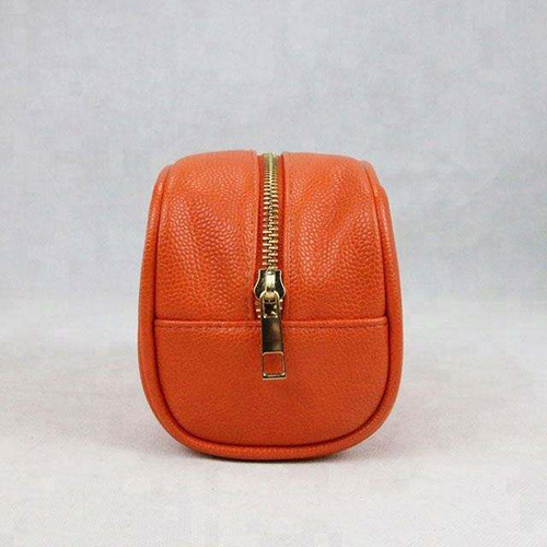 orange PU leather cosmetic organizer detail with smooth zipper and durable material